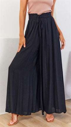 Stephanie - Floral Tiered Palazzo Trousers — Black